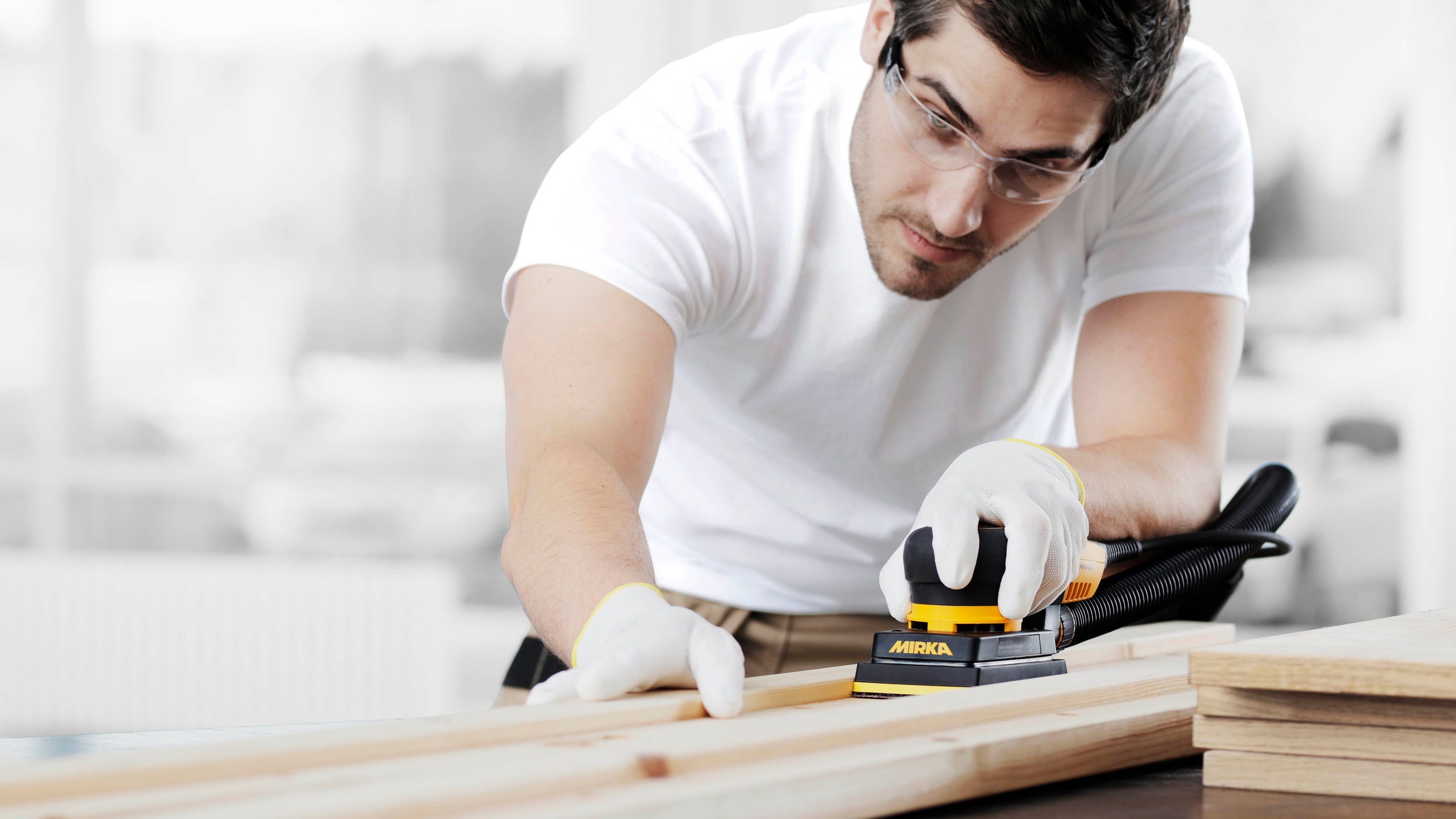 Sand wooden window and door frames with Mirka® DEOS Mirka