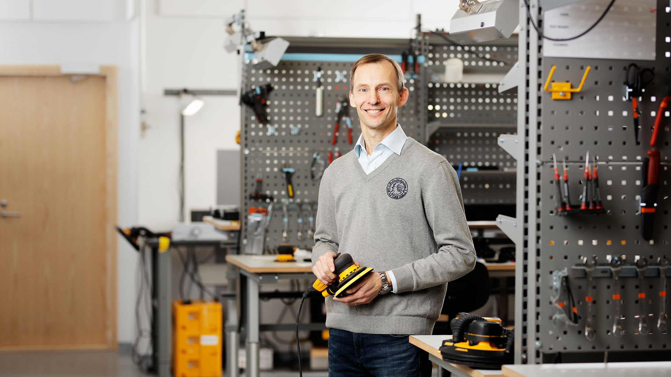 Mirka customer support specialist sitting by computer