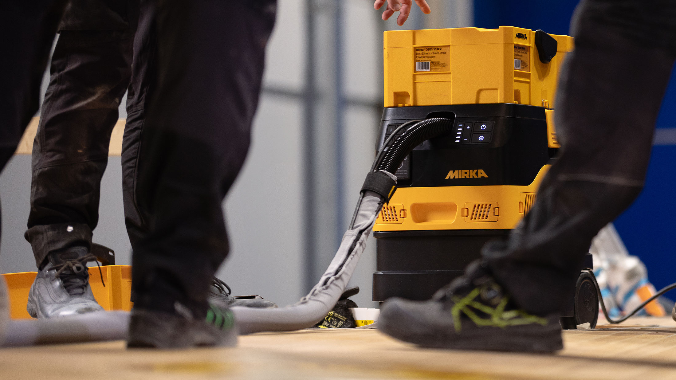 Woman sanding wall dust-free